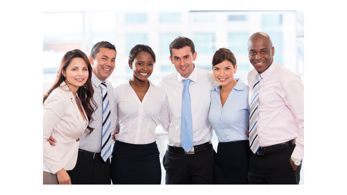 Happy business people standing together in an office